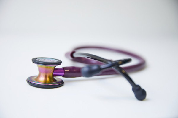 A photo showing a purple stethoscope
